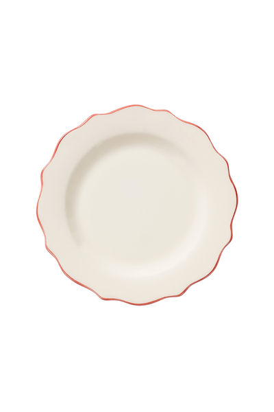 White ceramic plate with red rim on a white background